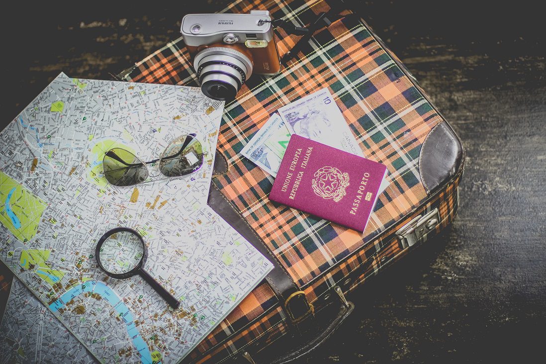 Passport, suitcase and map